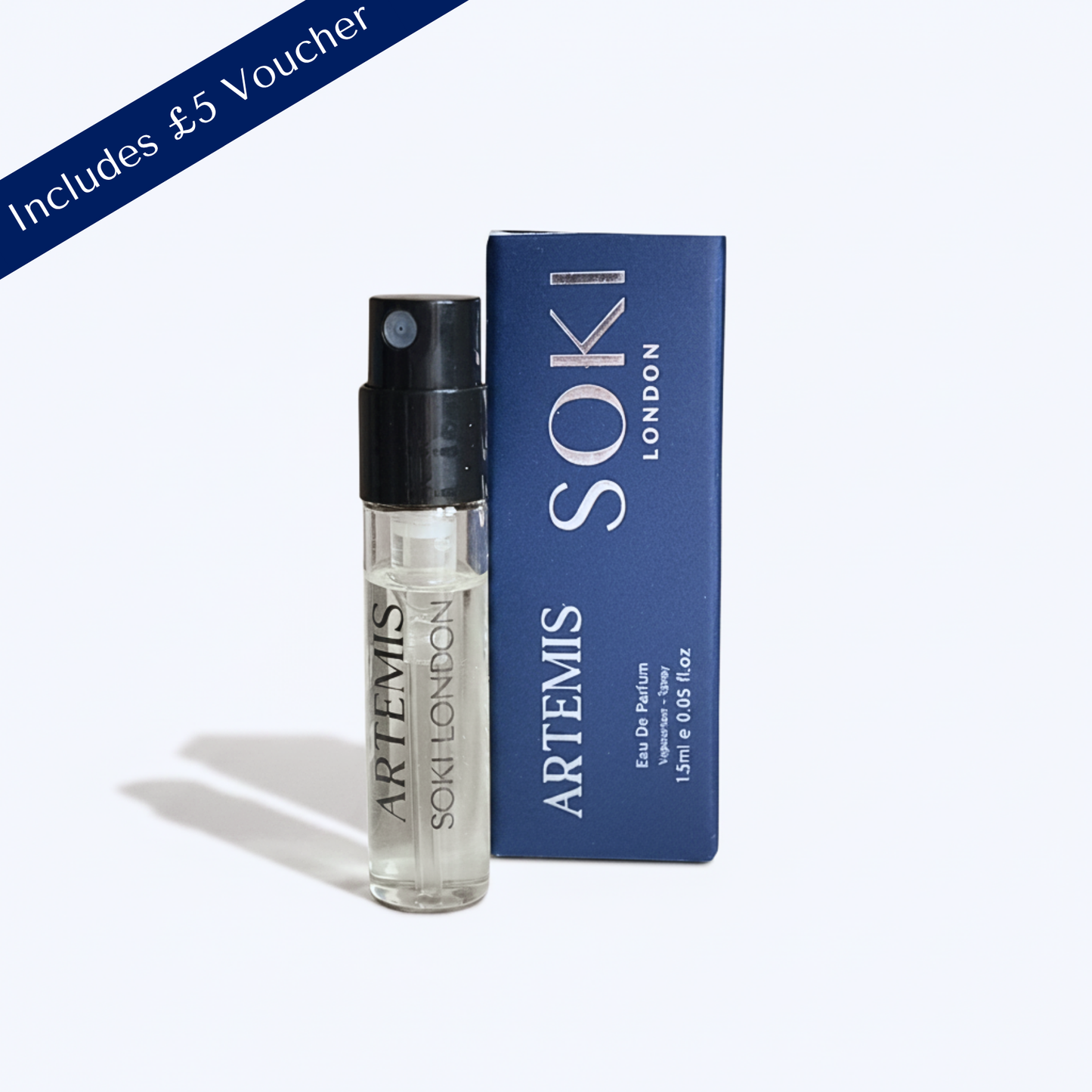 A small Artemis Soki London perfume sample bottle with a black spray top stands next to its blue box on a light gray background. A blue diagonal banner in the top-left corner reads 'Includes £5 Voucher'.